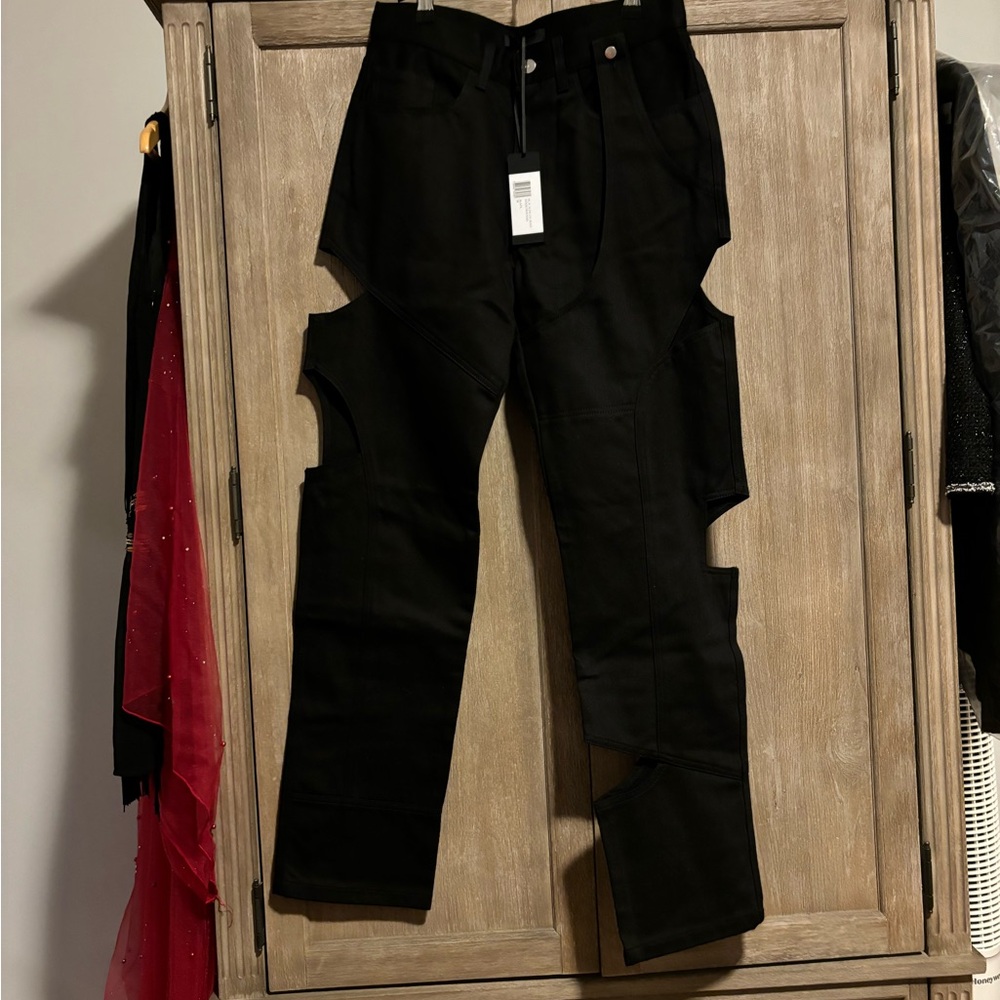 This is a pair of HELIOT EMIL asymmetric cut-out straight-leg jeans in black.